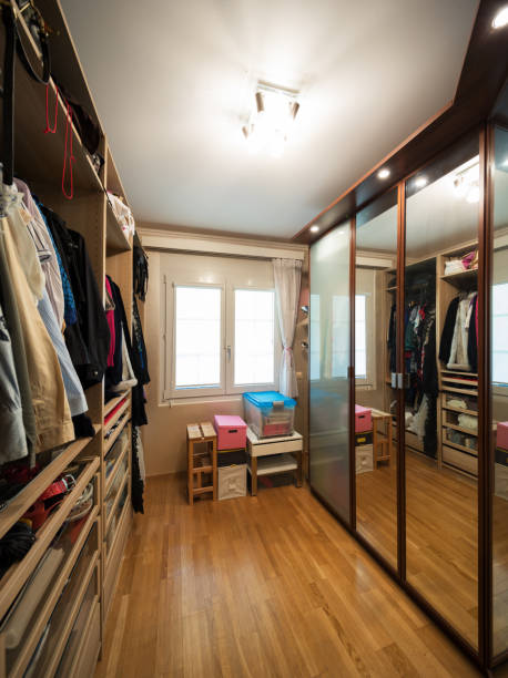 istock walk-in closet with clothes, parquet floor 941705404