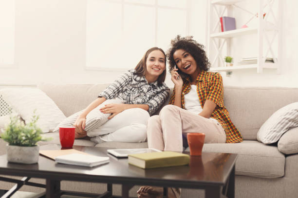 istock Girl overhearing her girlfriend mobile phone talk 941705812