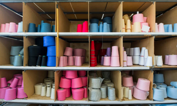 istock Spools with color thread at knitting factory view 941706014