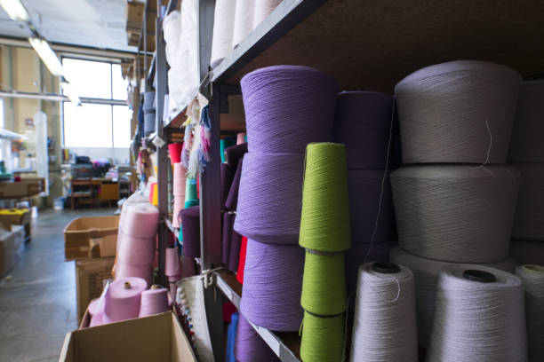 istock Spools with color thread at knitting shop view 941706186