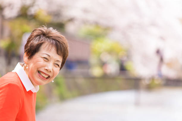 Japanese woman enjoying cherry blossom