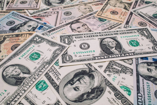 istock Pile of new and old one hundred dollar bills bills. 941706962