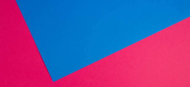istock Colorful papers geometry flat composition background with blue and pink tones 941709028