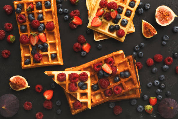 istock Round belgium waffles with berries top view 941709432