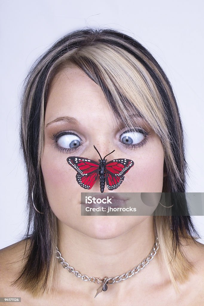Mariposa on Girl's Nose - Foto de stock de 18-19 años libre de derechos