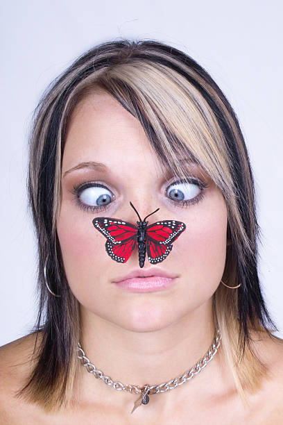 istock Butterfly on Girl's Nose 94171126