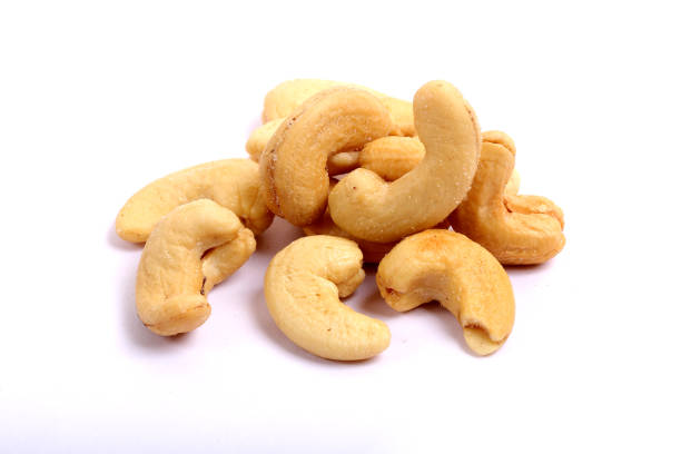 istock Unshelled roasted and salted cashew nuts isolated on white background 941711998