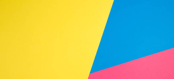 istock Color papers geometry flat composition background with yellow, pink and blue tones 941712122