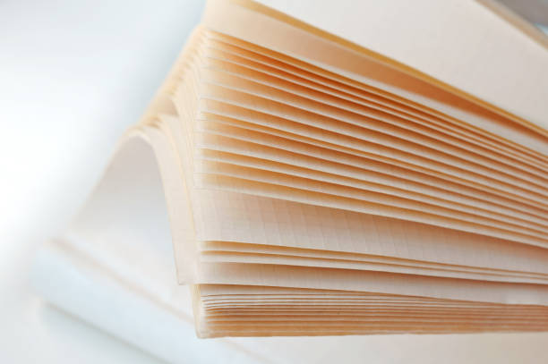 istock the leaves are thick notebook, the leaves of a notebook, half-open shared notebook 941712216