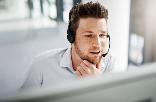 Whatever the query, he’ll ensure an effective resolution Shot of a handsome young man working in a call center headset stock pictures, royalty-free photos & images