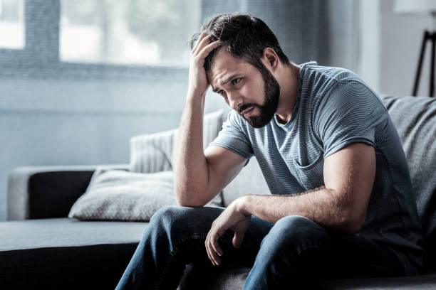 istock Sad unhappy man holding his forehead 941713036