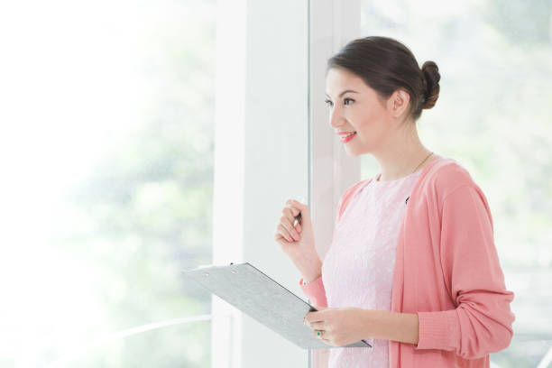istock Business woman standing working 941715650