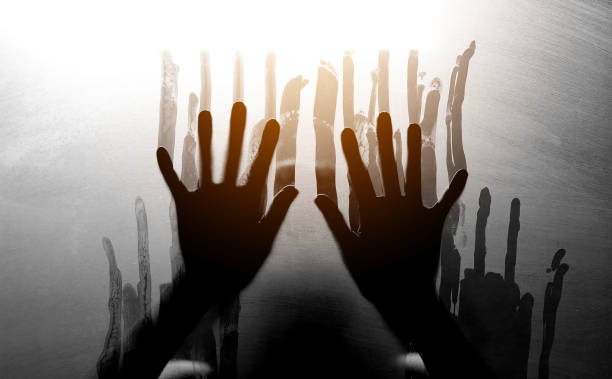 istock Shadowy figure behind glass. Fear and panic concept. 941717014