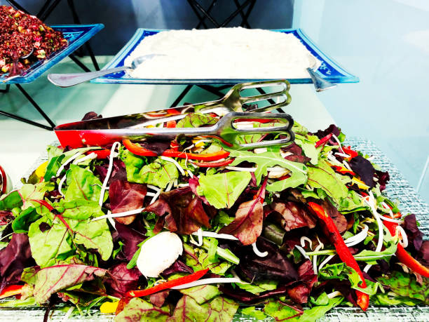 istock a mixture of various fresh lettuce leaves provided on a table. 941723928