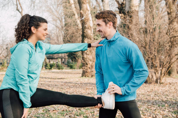 istock Fit couple exercising outdoors 941724152