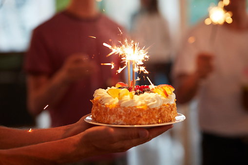 Young woman enjoying her birthday surprise