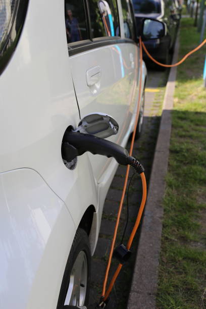 istock Electric Car Power Supply charging on charge station electro mobility environment friendly 941727774