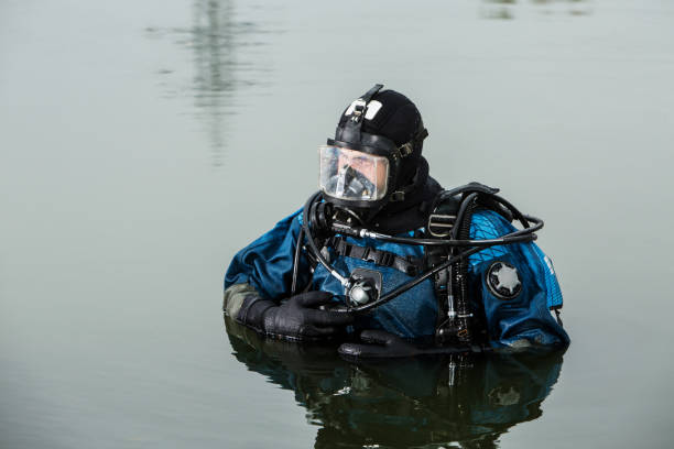 istock A male scuba diver comes from under the water climbs back on coast 941728414