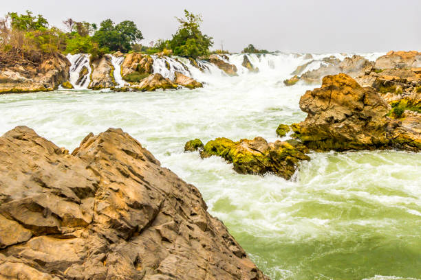 istock Beautiful view of waterfall landscape. Small waterfall in deep green forest scenery 941734282
