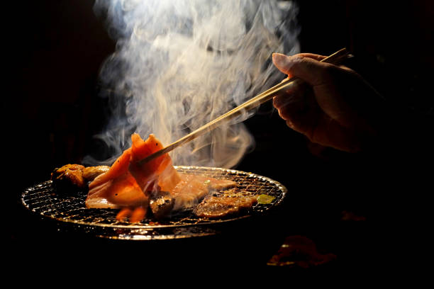 istock Grilled bacon and flame in Japanese restaurant 941737000