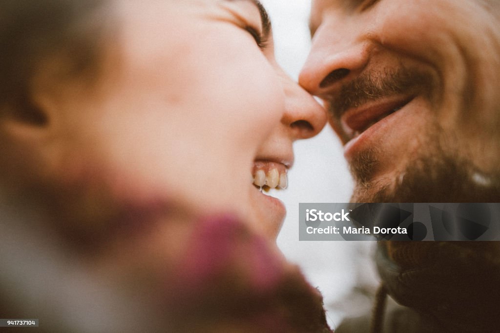 Photo of a lovely couple resting in public park Portrait of young lovely caucasian couple resting in public park. Exhilaration Stock Photo