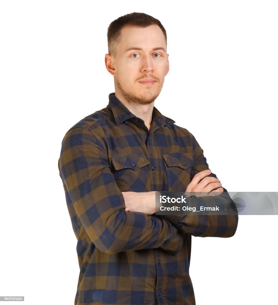 Portrait man in a checkered shirt, arms crossed on chest. Isolated on white background Looking Stock Photo