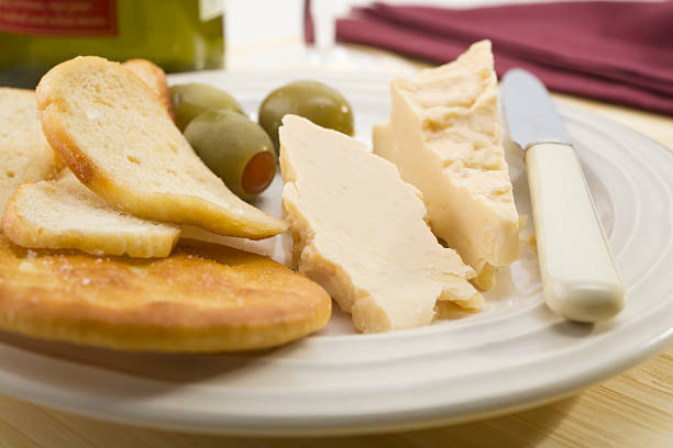 istock Gourmet Cheese and Biscuits with Olives 94173820