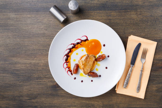 istock Roasted goose liver with date fruit and apple 941740856