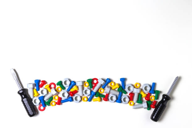 istock Kids construction tools background with colorful toys plastic bolts, nuts and screwdrivers 941741028