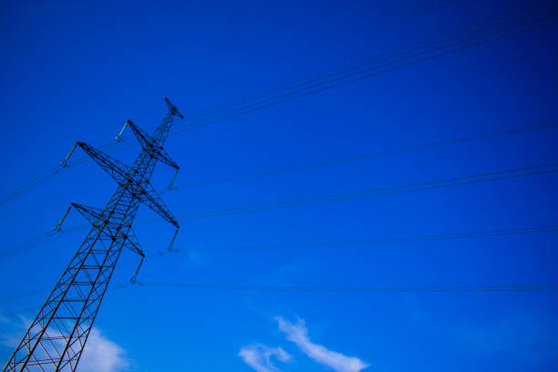 istock electric transmission line against blue sky background 941741714