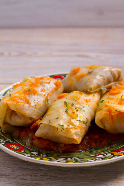 istock Cabbage rolls with meat, rice and vegetables. Stuffed cabbage leaves with meat. Chou farci, dolma, sarma, golubtsy or golabki 941742500