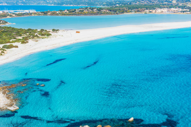 istock Blue water in Porto Giunco shoreline 941748938