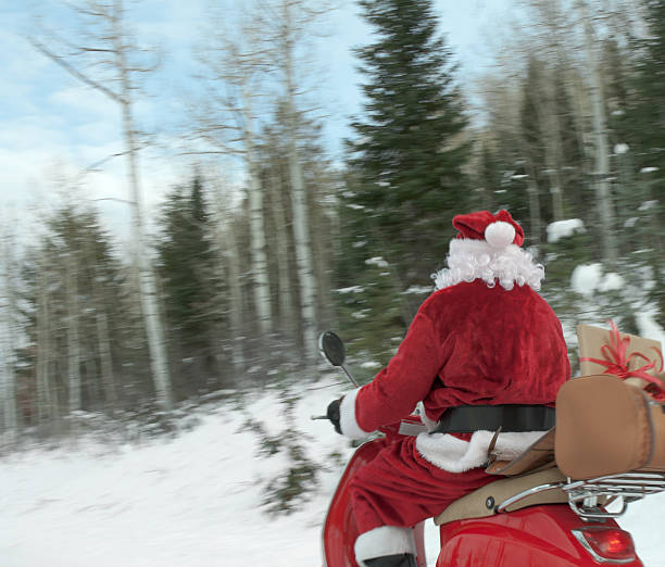 istock Santa Claus on a scooter 94175453