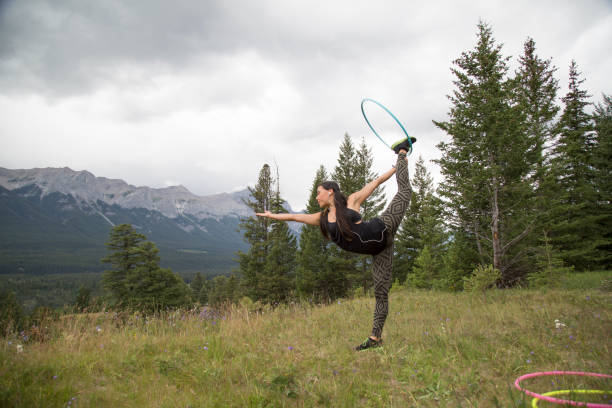 istock Native American woman dances with hoops, in mountains 941757652