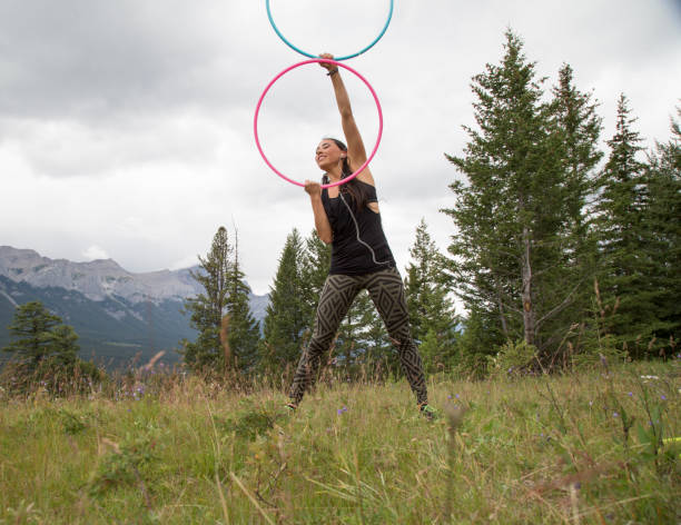 istock Native American woman dances with hoops, in mountains 941757666