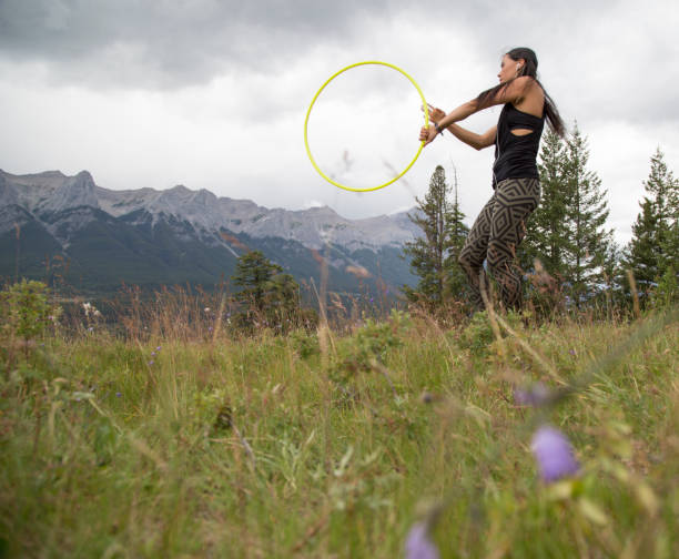 istock Native American woman dances with hoops, in mountains 941758102
