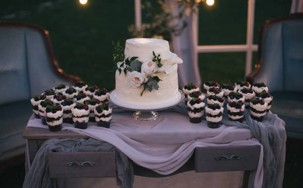 istock beautiful wedding cake and delicious desserts with berries on table 941758780