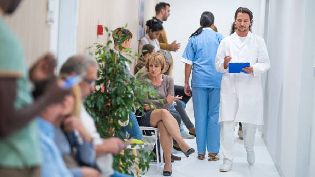 istock Patients waiting in waiting room 941762334