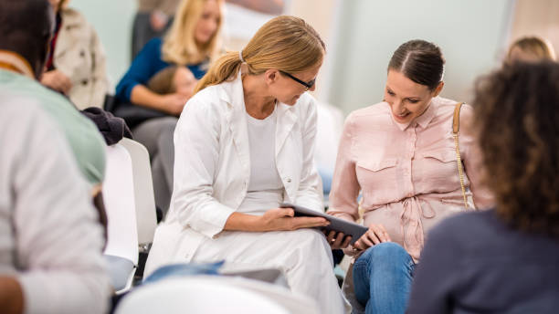 istock Doctor showing digital tablet to patient 941762348