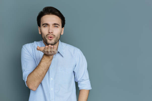 istock Pleasant nice man sending you a kiss 941763000