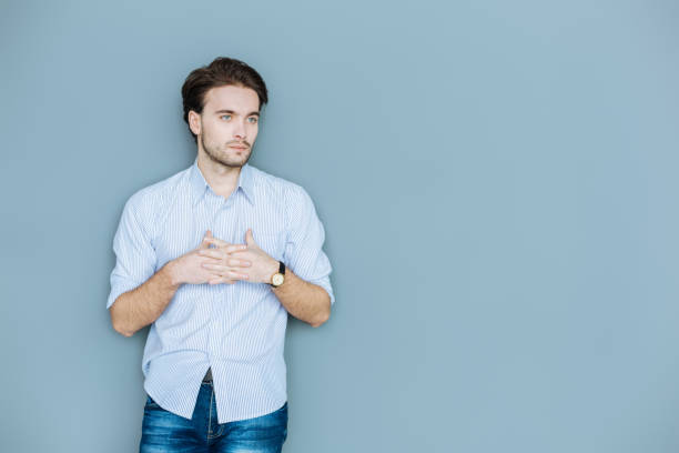 istock Serious thoughtful man putting his hands together 941766706