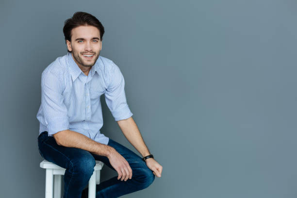 istock Delighted cheerful man smiling to you 941769402