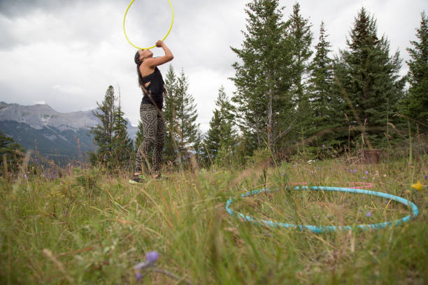 istock Native American woman dances with hoops, in mountains 941770008