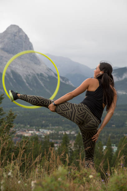istock Native American woman dances with hoops, in mountains 941770060