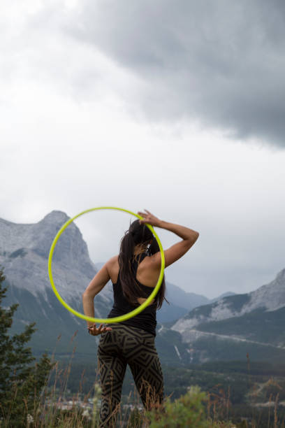 istock Native American woman dances with hoops, in mountains 941770188