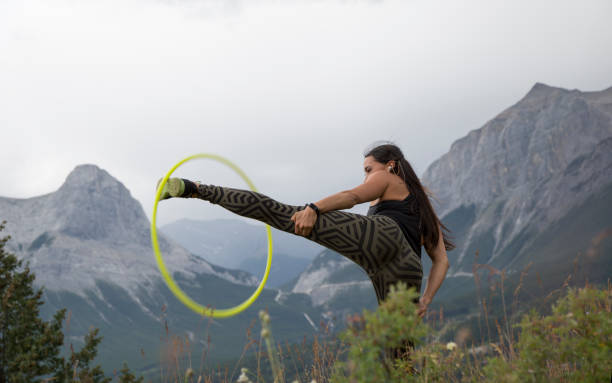 istock Native American woman dances with hoops, in mountains 941770264