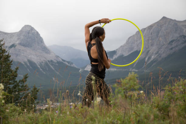 istock Native American woman dances with hoops, in mountains 941770382