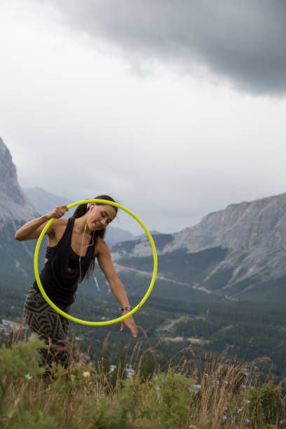 istock Native American woman dances with hoops, in mountains 941770690