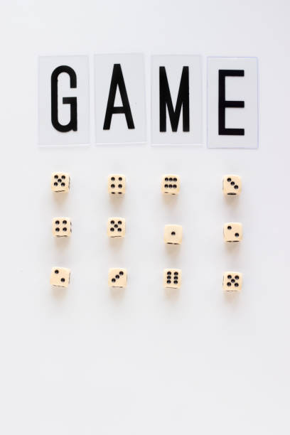 GAME word and gaming dice in row on white background.