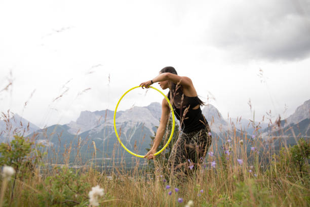 istock Native American woman dances with hoops, in mountains 941775618